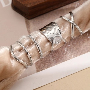 Five-piece silver stainless steel ring set with geometric lines and twisted textures