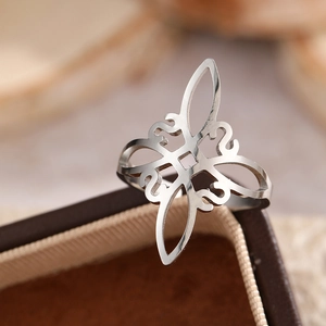 Minimalist silver stainless steel witch knot ring with hollow geometric pattern