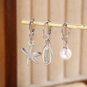 Three-piece stainless steel earring set with starfish, shell, and pearl charms for women