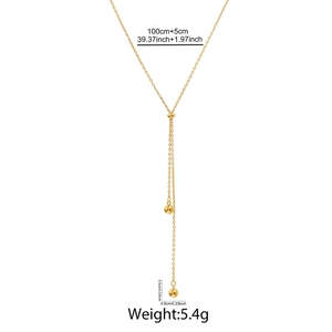 Detailed view of long 18K gold plated stainless steel Y-necklace with bead charms