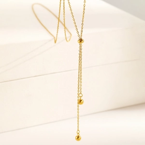Minimalist 18K gold stainless steel Y-shaped necklace with elegant lucky bead tassels