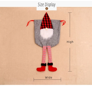 Christmas gnome drawstring gift bag with red plaid hat and striped legs size display