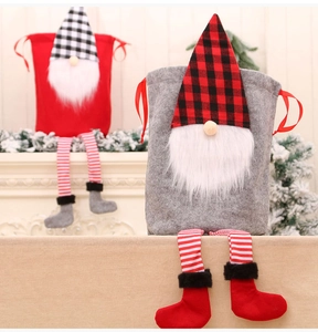 Detail of Christmas gnome drawstring gift bags with striped long legs and fur boots