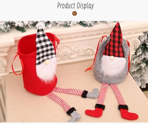 Detail of Christmas gnome drawstring gift bags with long legs on a festive mantle