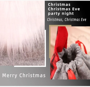 Close-up of Christmas gift bag with gray felt, faux fur, and red plaid drawstring detail
