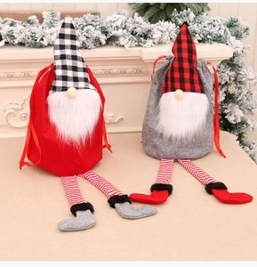 Detail showing Christmas gnome drawstring gift bags with long legs and plaid patterns