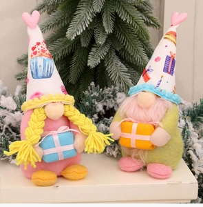 Detail of plush faceless gnomes with pink hearts and cupcake pattern hats for Valentine