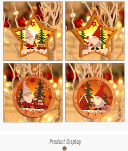 Macro detail of LED wooden Christmas ornaments featuring Santa gnome and festive trees