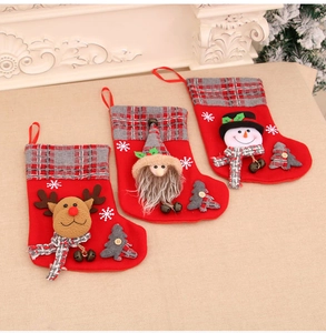 Three medium 3D Christmas stockings featuring reindeer, gnome, and snowman designs