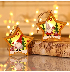 Star-shaped wooden Christmas pendants with glowing warm LED lights and Santa scene