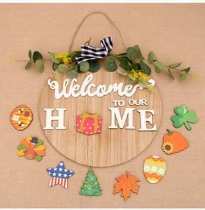Macro detail of wooden welcome sign with interchangeable holiday icons and burlap bow