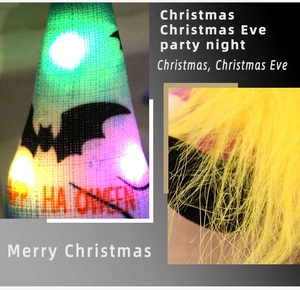 Detail of Halloween glowing gnome hat with bat patterns and soft faux fur texture