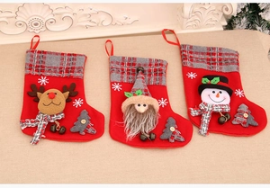 Detail of 3D Santa, reindeer and snowman plush Christmas stockings with plaid cuffs