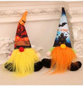 Detail of two Halloween gnomes with patterned hats and colorful plush long beards
