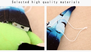 Detail showing the internal battery box, power switch, and hanging lanyard of the plush toy