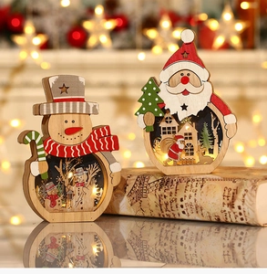 Macro view of illuminated wooden Santa and snowman ornaments with warm LED lighting