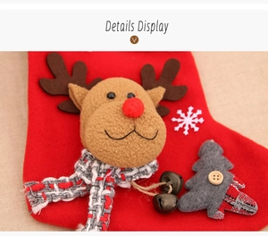 Detailed close-up of red plush Christmas stocking with 3D reindeer and small bells