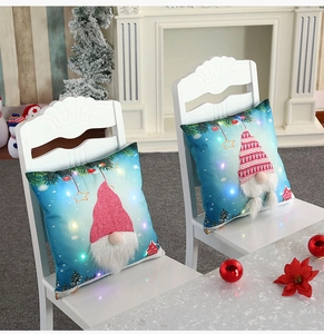 Detail of Christmas gnome pillowcase with LED glowing lights and sequined hat decoration