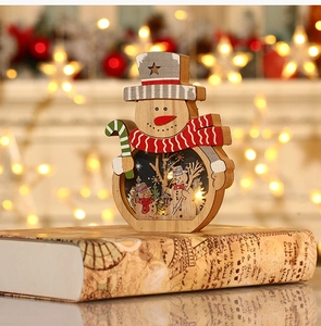 Macro view of a wooden LED snowman figurine with warm lights on vintage books