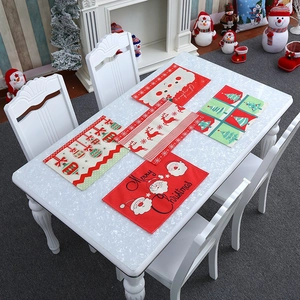 5-piece Merry Christmas placemat set featuring Santa, reindeer, and tree on marble table