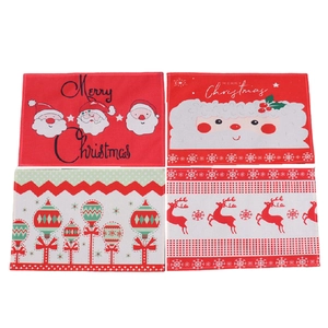Set of four Christmas dining placemats with Santa and Reindeer holiday patterns