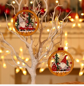 Close-up of wooden Christmas gnome ornaments hanging with festive warm bokeh lights