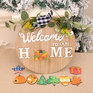 Wooden welcome door sign with interchangeable holiday icons and black white bow