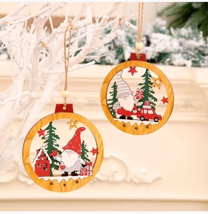 Detail of wooden Christmas gnome pendants with layered forest and XMAS truck scenes