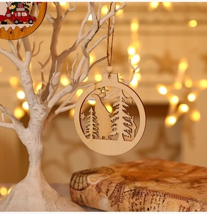 Detail of laser-cut wooden Christmas ornament with forest silhouette and star patterns