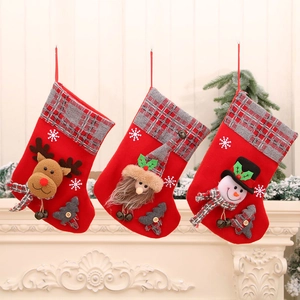 Set of 3 3D Christmas stockings with Santa, Snowman and Reindeer on a white fireplace