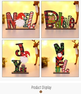 Detailed view of DIY wooden Christmas letter signs with festive gnome and plaid patterns