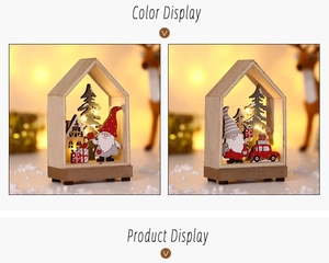 Detail of wooden Christmas house with LED lights showing Santa and laser cut forest elements