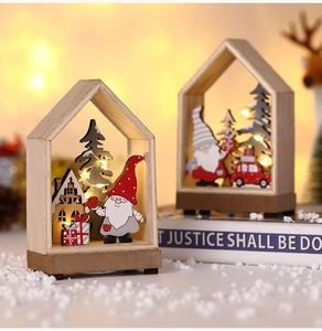 Detail of wooden Christmas house with glowing LED lights and forest gnome decor