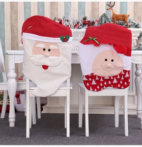 Detail of Christmas chair covers featuring Santa Claus and snowman with festive patterns