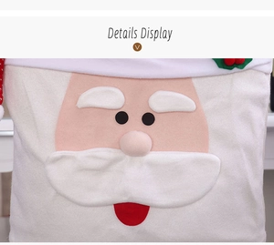 Close-up of plush Santa Claus chair cover detail with white fur and cartoon facial patterns