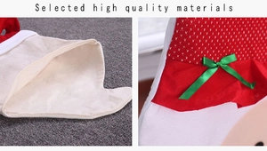 Detail of red Christmas chair cover featuring high quality knit fabric and green silk bow