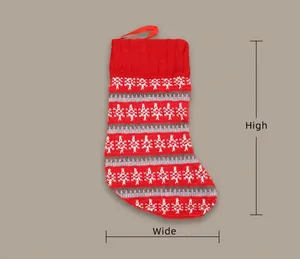 Detail view of red knitted Christmas stocking with pine tree patterns and size markers