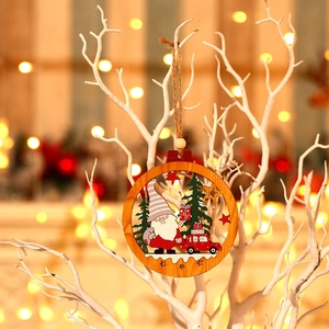 Round wooden Christmas gnome ornament with red car and trees hanging on a white branch