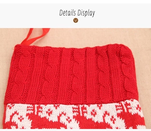 Macro detail of red cable-knit Christmas stocking with white holiday pattern and hanging loop