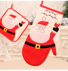 Close-up of Santa Claus embroidered oven mitt and heat-resistant potholder set