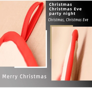 Detail of Christmas oven mitt with red hanging strap and knit texture stitching