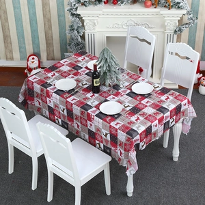 Christmas rectangular tablecloth with festive deer and snowflake patterns on a dining table