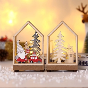 Lighted wooden Christmas cabin ornaments with Santa Claus and festive LED glow decor