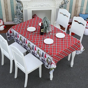 Christmas gnome pattern tablecloth with red checkered design for holiday dining room decor