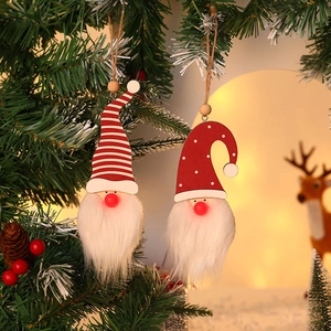 Illuminated Christmas gnome ornaments with plush beards hanging on a festive tree