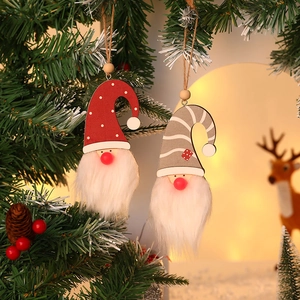 Set of two glowing Christmas forest gnomes hanging on pine branches with warm LED lights