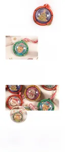 Detail of DIY wooden Christmas ornaments with hand-painted Santa and reindeer patterns