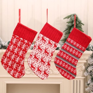 Three-piece knitted Christmas stockings set with reindeer and snowflake patterns