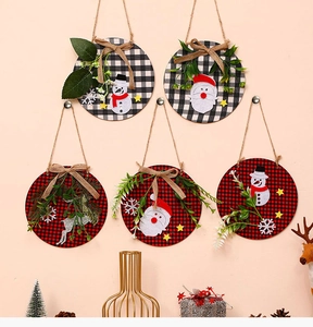 Detailed view of 5-piece Christmas wooden door hangers with buffalo plaid and burlap bows