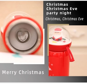 Detail view of SUS 304 stainless steel interior and Santa Claus landscape lid on red bottle